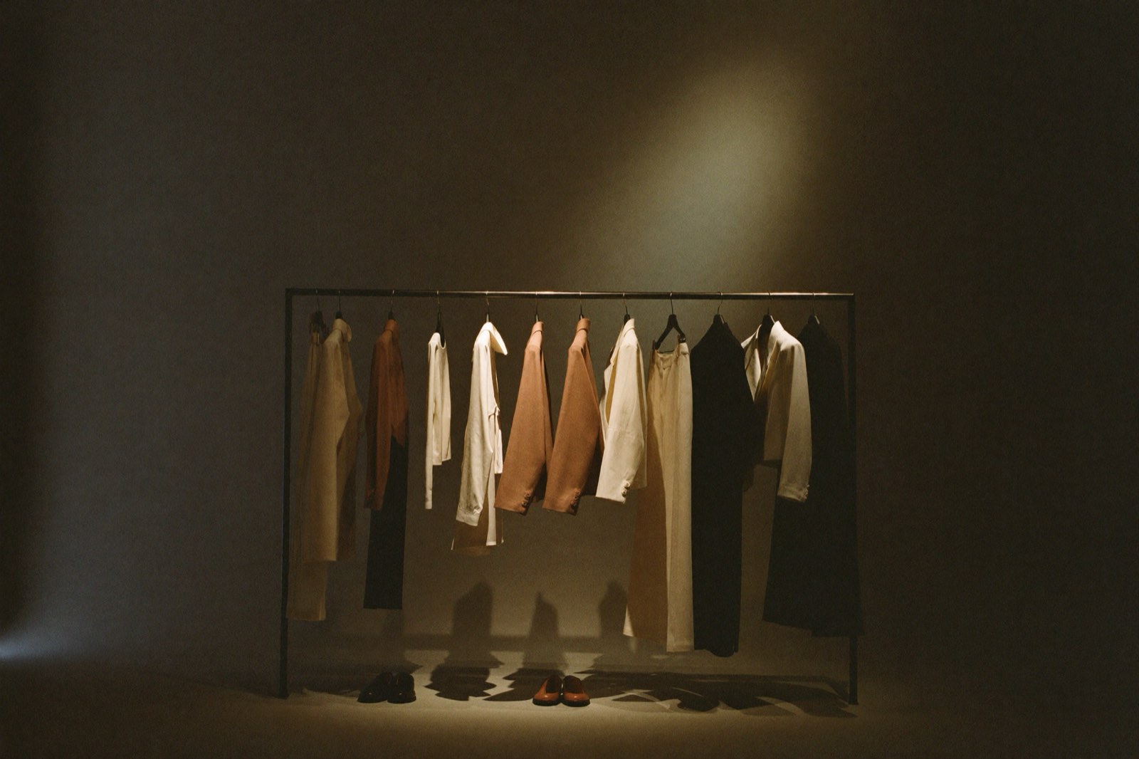 Small curated capsule wardrobe rail with nine garments and generous empty space